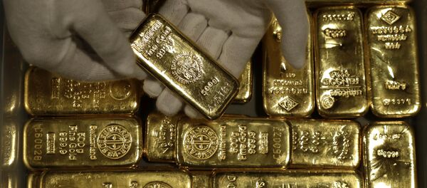 Золотые слитки, фото из архива Золотые слитки, фото из архива - Sputnik Азербайджан