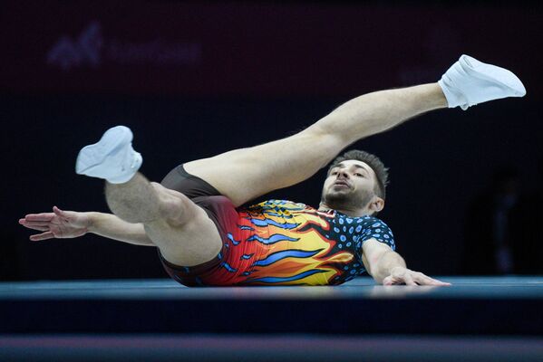 Азербайджанский гимнаст Владимир Долматов  во время выступления на 16-м чемпионате мира по спортивной аэробике в Баку  - Sputnik Азербайджан