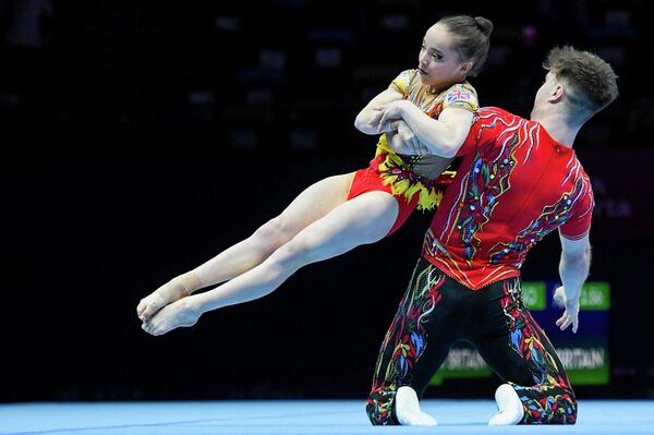 Спортсмены Великобритании во время выступления на чемпионате мира по акробатической гимнастике в Баку. - Sputnik Азербайджан