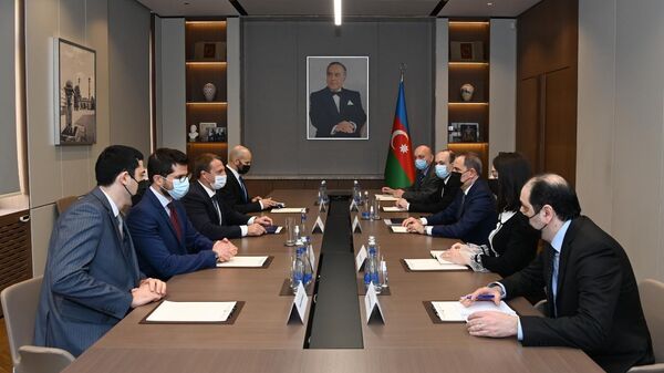 Джейхун Байрамов и Йоэл Развозов во время встречи - Sputnik Азербайджан
