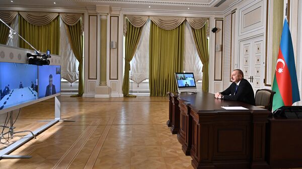 Видеовстреча президента Азербайджана Ильхама Алиева и генерального директора FAO Цюй Дунъюя - Sputnik Азербайджан
