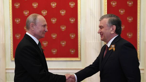 Şavkat Mirziyoyev və Vladimir Putin, arxiv şəkli - Sputnik Azərbaycan
