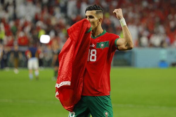 Защитник Марокко Джавад Эль-Ямик празднует победу. - Sputnik Азербайджан