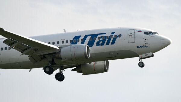 Пассажирский самолет Boeing 737-500 авиакомпании UTair, фото из архива - Sputnik Азербайджан