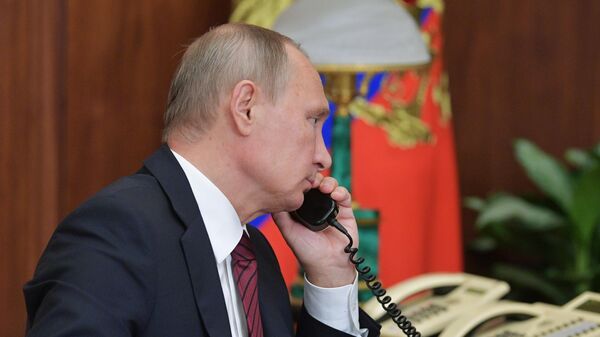 Президент РФ В. Путин провел телефонный разговор с главами ДНР А. Захарченко и ЛНР И. Плотницким - Sputnik Азербайджан