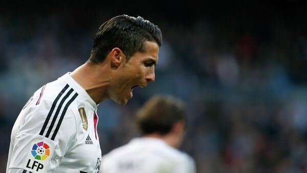 Real Madrid's Cristiano Ronaldo reacts during their Spanish first division soccer match against Espanyol at Santiago Bernabeu stadium in Madrid January 10, 2015. - Sputnik Азербайджан