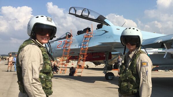 Russian pilots prepared to board the SU-30 attack plane to take off from the Hmeimim aerodrome in Syria. - Sputnik Azərbaycan