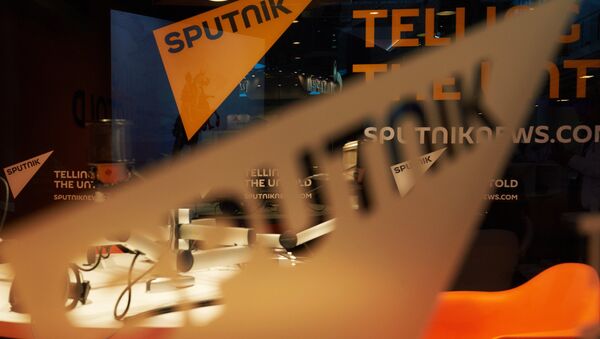 Pavilion of the Sputnik international information brand at the Lenexpo Exhibition Center ahead of the 2015 St. Petersburg International Economic Forum - Sputnik Азербайджан