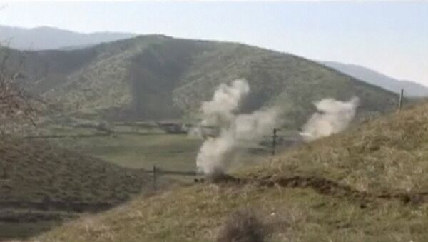 Smoke rises after clashes between Armenian and Azeri forces in Nagorno-Karabakh region in this still image taken from video provided by the Nagorno-Karabakh region Defence Ministry April 2, 2016. - Sputnik Azərbaycan