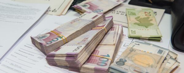 Пачки азербайджанских манатов Пачки азербайджанских манатов - Sputnik Азербайджан