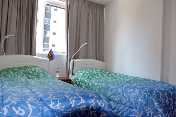 Одна из комнат азербайджанских спортсменов в Олимпийской деревне - Sputnik Азербайджан