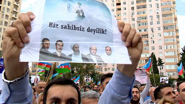 Участник митинга, организованного Национальным советом - Sputnik Азербайджан
