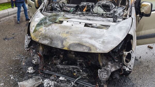 Сгоревший автомобиль, архивное фото - Sputnik Азербайджан