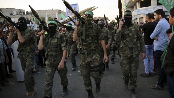 Палестинские члены бригады Изз ад-Дин аль-Кассам военного крыла ХАМАС - Sputnik Azərbaycan