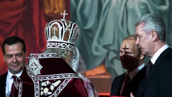 From left: Russian Prime Minister Dmitry Medvedev, Orthodox Patriarch Kirill, President Vladimir Putin, and Moscow Mayor Sergei Sobyanin attend the Easter service in the Christ the Savior Cathedral in Moscow, Russia - Sputnik Azərbaycan