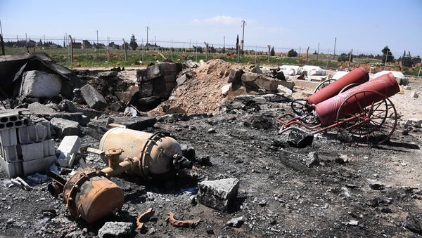 Последствия ракетного удара США по авиабазе в Сирии, фото из архива - Sputnik Azərbaycan