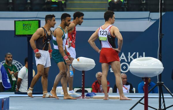 Финалы соревнований по спортивной гимнастике среди мужчин и женщин в упражнениях на коне и перекладине, в опорном прыжке, в вольных упражениях и на бревне - Sputnik Азербайджан