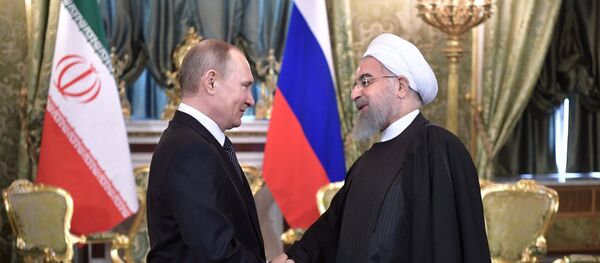 Президент РФ Владимир Путин и президент Исламской Республики Иран Хасан Рухани во время встречи, 28 марта 2017 года Президент РФ Владимир Путин и президент Исламской Республики Иран Хасан Рухани во время встречи, 28 марта 2017 года - Sputnik Азербайджан
