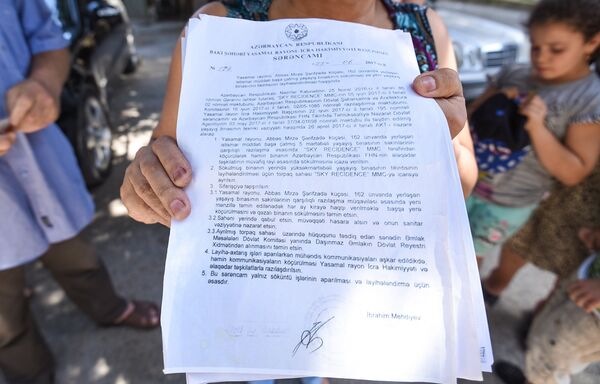 У компании строителя имеется официальная договоренность с исполнительной властью Ясамальского района Баку У компании строителя имеется официальная договоренность с исполнительной властью Ясамальского района Баку - Sputnik Азербайджан