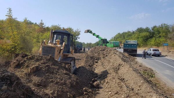 Ремонтно-восстановительные работы на участке автодороги Муганлы-Исмаиллы - Sputnik Азербайджан