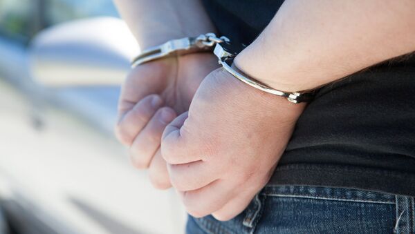Арестованный в наручниках,  фото из архива - Sputnik Азербайджан