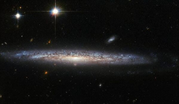 Галактики NGC 5714 и NGC 1787, снятые телескопом Хаббл - Sputnik Азербайджан