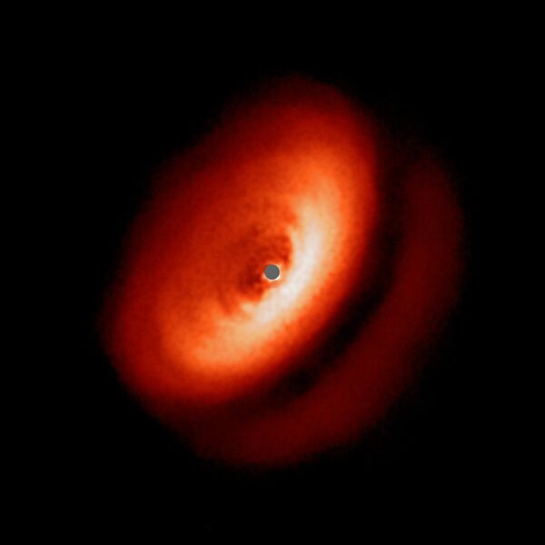Пылевой диск вокруг молодой звезды IM Lupi - Sputnik Азербайджан