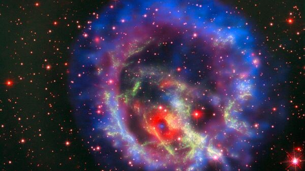 Остатки сверхновой 1E 0102.2-7219, расположенной в ближайшей к нам галактике Малое Магелланово Облако - Sputnik Азербайджан