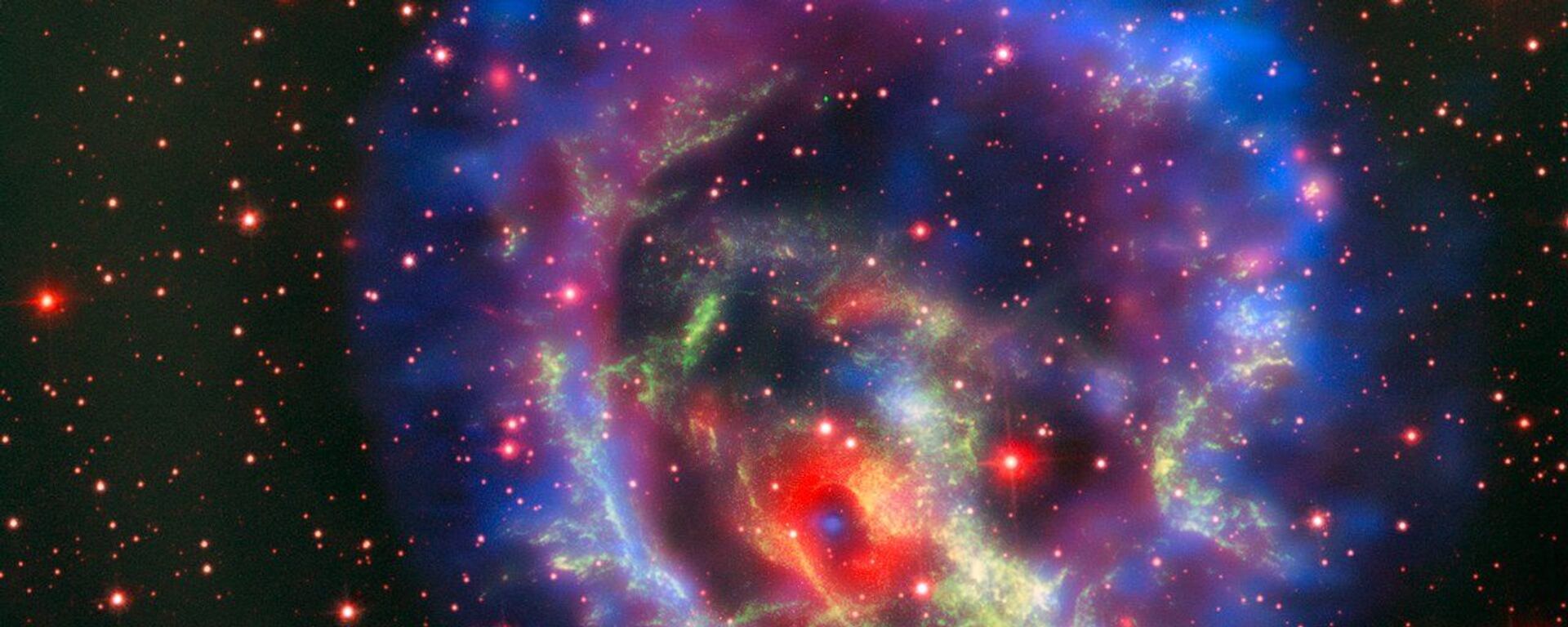 Остатки сверхновой 1E 0102.2-7219, расположенной в ближайшей к нам галактике Малое Магелланово Облако - Sputnik Азербайджан, 1920, 27.09.2023