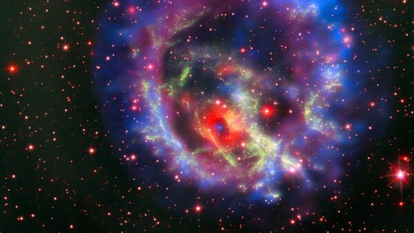 Остатки сверхновой 1E 0102.2-7219, расположенной в ближайшей к нам галактике Малое Магелланово Облако - Sputnik Азербайджан