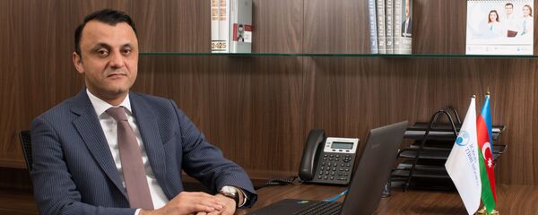 Руководитель департамента обязательного медицинского страхования Государственного агентства обязательного медицинского страхования Вугар Гурбанов - Sputnik Азербайджан