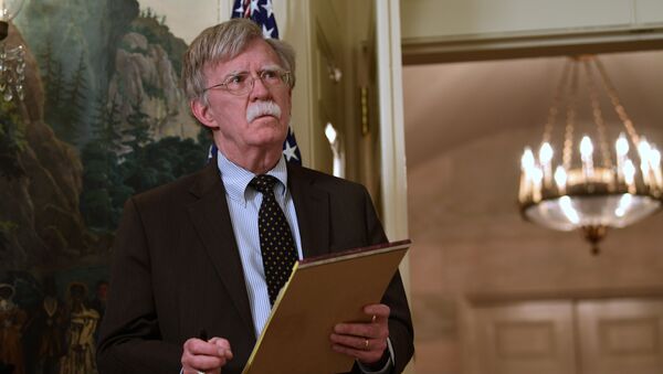 National security adviser John Bolton listens President Donald Trump speaks in the Diplomatic Reception Room of the White House on Friday, April 13, 2018, in Washington, about the United States' military response to Syria's chemical weapon attack on April 7 - Sputnik Azərbaycan