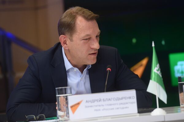 Заместитель главного редактора МИА Россия сегодня Андрей Благодыренко Заместитель главного редактора МИА Россия сегодня Андрей Благодыренко - Sputnik Азербайджан