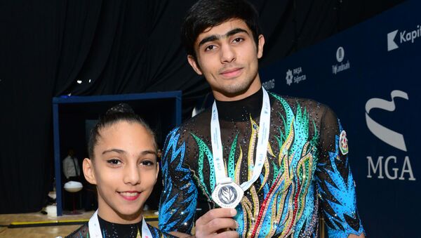 Азербайджанские гимнасты- Абдулла Аль-Мяшайхи и Рухидил Гурбанлы - Sputnik Азербайджан