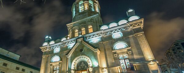 Рождественское богослужение в Кафедральном соборе Жен Мироносиц в Баку. 7 января 2019 года. - Sputnik Азербайджан