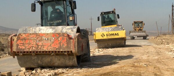 Реконструкция автодороги в Гарадагском районе Баку Реконструкция автодороги в Гарадагском районе Баку - Sputnik Азербайджан