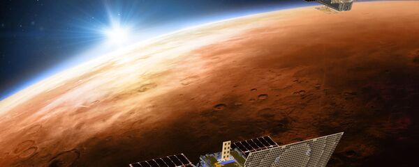 Иллюстрация NASA c изображением двух космических кораблей проекта Mars Cube One, летящих над Марсом - Sputnik Азербайджан