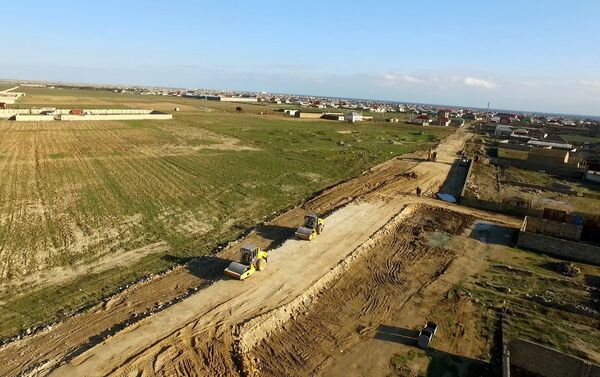 Строительство новой автомобильной дороги в Сураханском районе - Sputnik Азербайджан