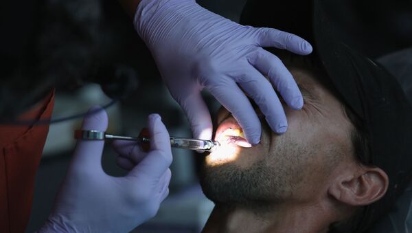 На приеме у стоматолога, фото из архива - Sputnik Азербайджан