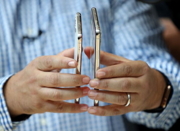 Демонстрация нового Apple iPhone 11 Pro в Калифорнии  - Sputnik Азербайджан