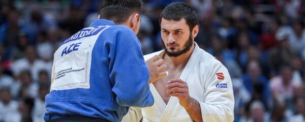 Азербайджанский дзюдоист Зелим Коцоев потерпел поражение от россиянина Казбека Занкишиева Азербайджанский дзюдоист Зелим Коцоев потерпел поражение от россиянина Казбека Занкишиева - Sputnik Азербайджан