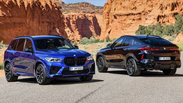 Немецкая автомобильная компания BMW представила новые версии своих знаменитых моделей X5 и X6 - Sputnik Азербайджан