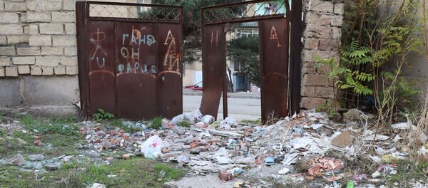Günəşlidə məişət tullantıları atılan ərazi Günəşlidə məişət tullantıları atılan ərazi - Sputnik Азербайджан