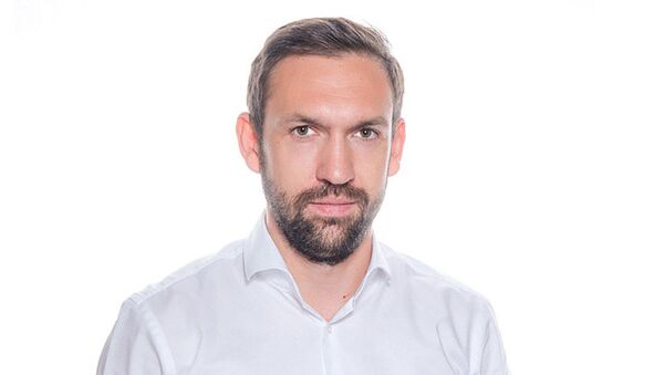 Руководитель департамента инвестиционных стратегий БКС Юрий Скоркин - Sputnik Азербайджан