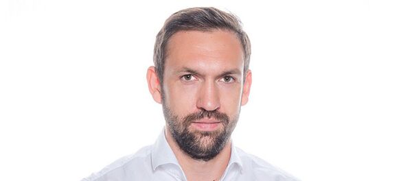 Руководитель департамента инвестиционных стратегий БКС Юрий Скоркин - Sputnik Азербайджан