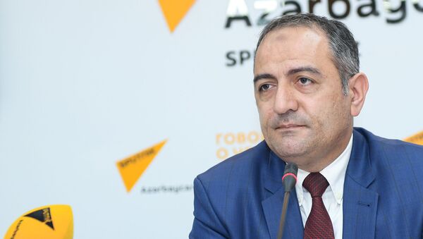 Председатель Центра изучения экономических ресурсов Руслан Атакишиев - Sputnik Azərbaycan