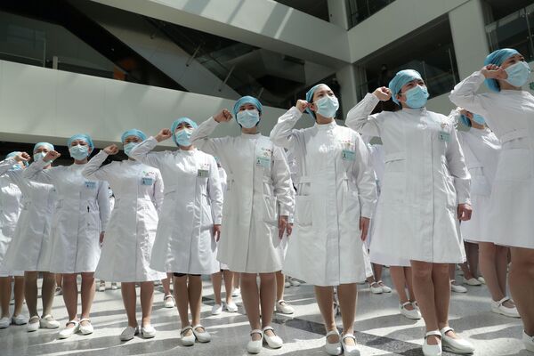 Медсестры во время мероприятия по случаю Международного дня медсестер в Китае - Sputnik Азербайджан